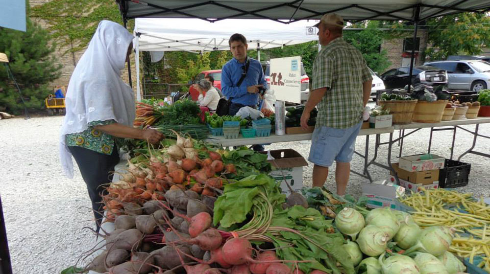 Loyola's Farmers Market's new location is just steps from the Loyola stop on the CTA Red Line in Loyola Plaza. 